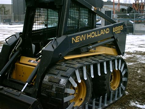 track skid steer pushing snow|track cleats for skid steer.